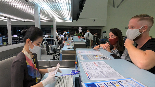 SAGS’s staff in Asiana Airlines (OZ) uniform do check-in procedures for passengers.
